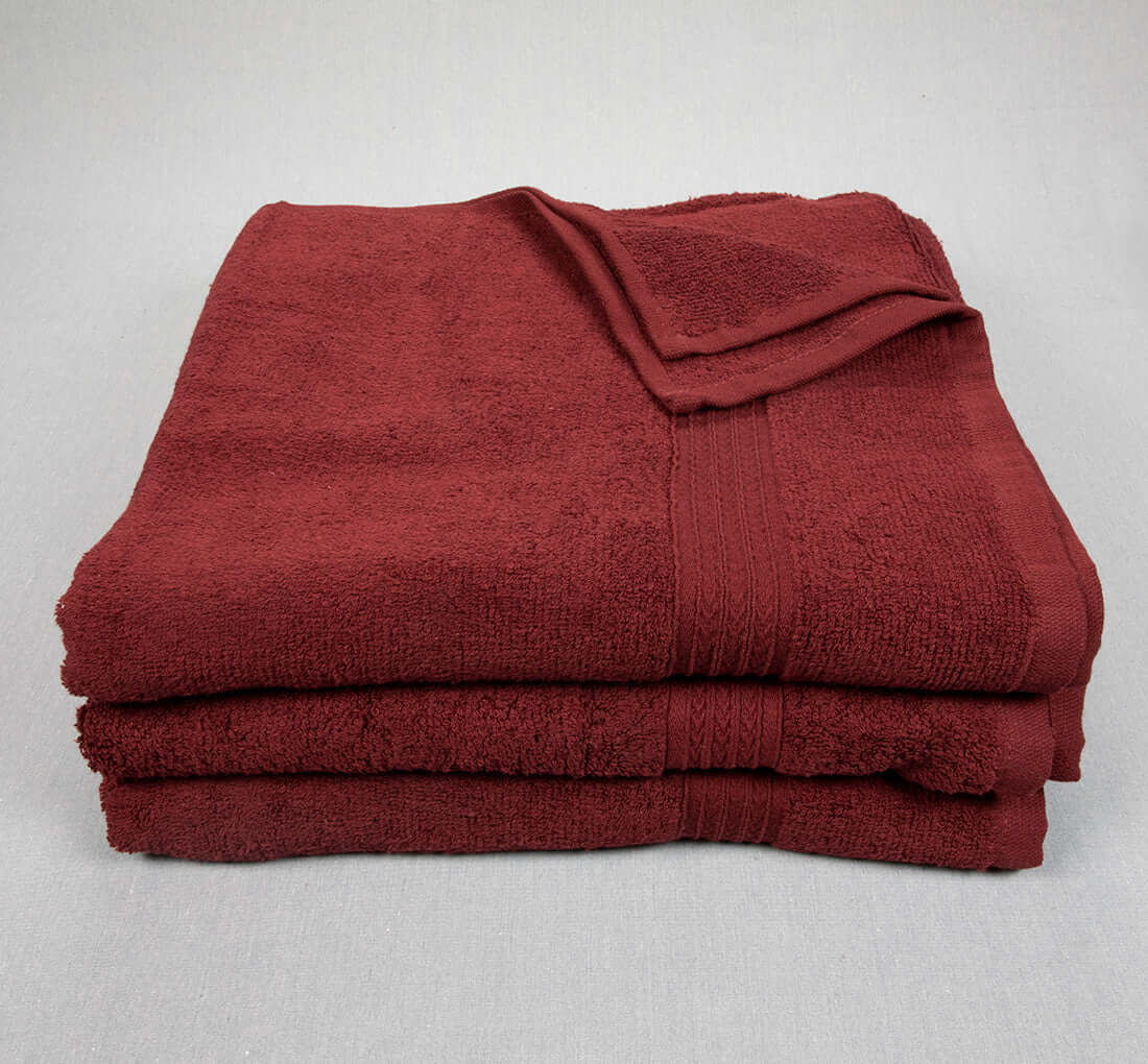 https://wholesaletowel.com/cdn/shop/products/27x54-Bath-Towels-Maroon.jpg?v=1685995131&width=1445